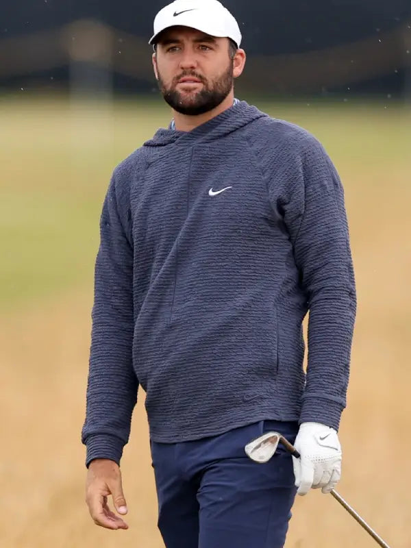 Man in navy blue Nike outfit on a golf course