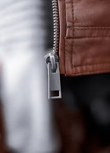 A zip pull set into a leather placket