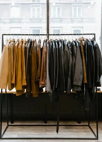 Racks of finished leather jackets inside the Iron Crest atelier