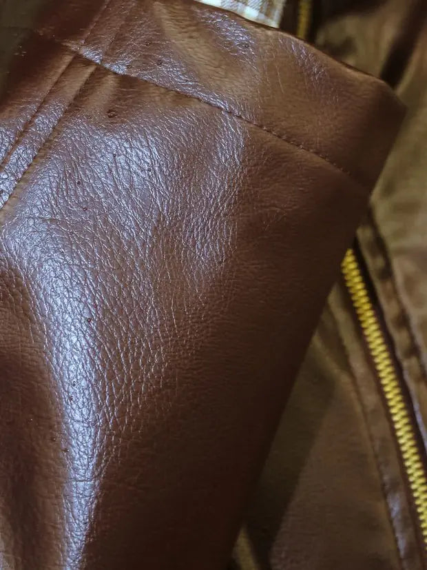 Solid metal zip and pull on a leather cuff